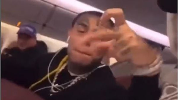 Tekashi 6ix9ine Throws Up Gang Signs & Almost Gets Kicked Off Flight