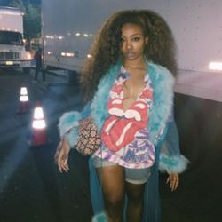 SZA flashes her underboob as she poses in a string bikini and thong
